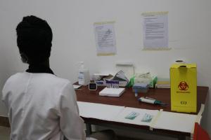 Healthcare worker screening a patient at Juba Teaching Hospital during the commemoration of the World Hepatitis Day in Juba