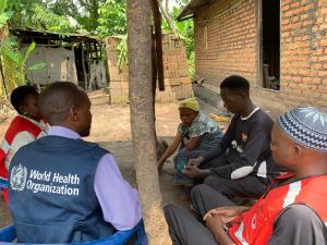 A WHO staff member conducting a community engagement session