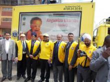 03 A team of Lions International Club of Kenya pose in front of the Transnational Road Show vehicle