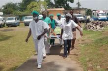 An injured person being taken to the field ward