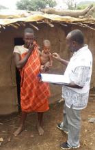 Dr Kibet Sergon, WHO, interviews a mother during the MNTE survey 