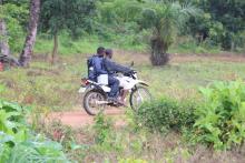 health workers transporting the vaccine on motorbike to remote communities through difficult terrains. Photo credit: WHO/S. Gborie