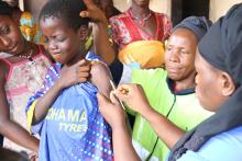 The vaccine being administered to a child in Yendeya village. photo credit: WHO/S. Gborie