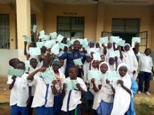 School pupils displaying cards after Yellow fever vaccination