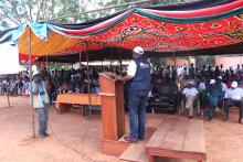 Mr Liyosi speaking to the Governor, top leaders and the community during rally in Tambura, one of the high risk areas bordering DRC