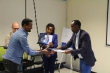 Dr. Ebba Abate the Director of the Ethiopian Public Health Institute providing certificate for the trainees