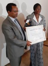 WHO Representative presenting World No-Tobacco Day Award to the Hon. Minister of health and Social Welfare
