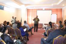 Dr Paul Mainuka delivering a remark during the oppening session of team building workshop