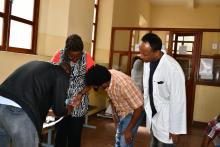 Dr Ruth Jahonga, facilitator of the training demonstrating some practical to the trainees