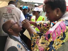 A public official receives the cholera vaccine on May 27, 2019