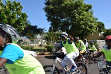 Dr Laurent Musango, WHO Representative in Mauritius riding his bike to support cycling activity organized by the Ministry of Youth and Sports