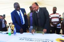 Honorable Moyo signing the pledge to fight tobacco smoking and use of drugs and illicit drug trafficking