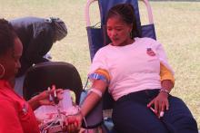 A member of the public donating blood during the commemoration