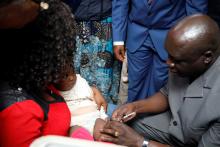 02 WHO OiC vaccinating an eligible child during the launch.jpg