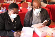 Participants receiving copies of Quarantine Centre guidelines for redistribution in their different provinces 