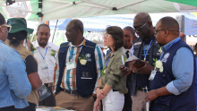 WHO staff and partners taking a tour by the information stalls during World Malaria Day commemoration in Maun, May 2023