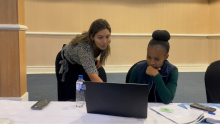 Stefany Ildefonso, training officer from the WHO Hub for Pandemic and Epidemic Intelligence helps participant from National Health Laboratory with navigating EIOS platform.