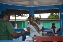 A mother and her son getting the vaccination card