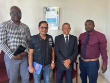 WHO experts meets with village leadership