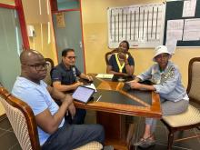 WHO experts meets with village leadership