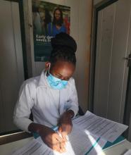 A nurse updating health records