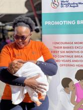 Dr Sithembile Dlamini-Nqeketo , WHO South Africa Reproductive, Maternal, Neonatal, Child & Adolescent health Officer illustrating to mothers breastfeeding positioning during a Breastfeeding Campaign at Loftus Park in Pretoria