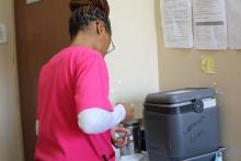 Lobamba Clinic Nurse preparing the MR vaccine