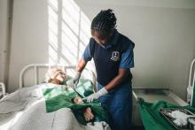 Eunice Mapenzi demonstrates how to dress a wound at the Kenya Medical Training College Skills Lab, Nairobi. © WHO / Khadija Farah