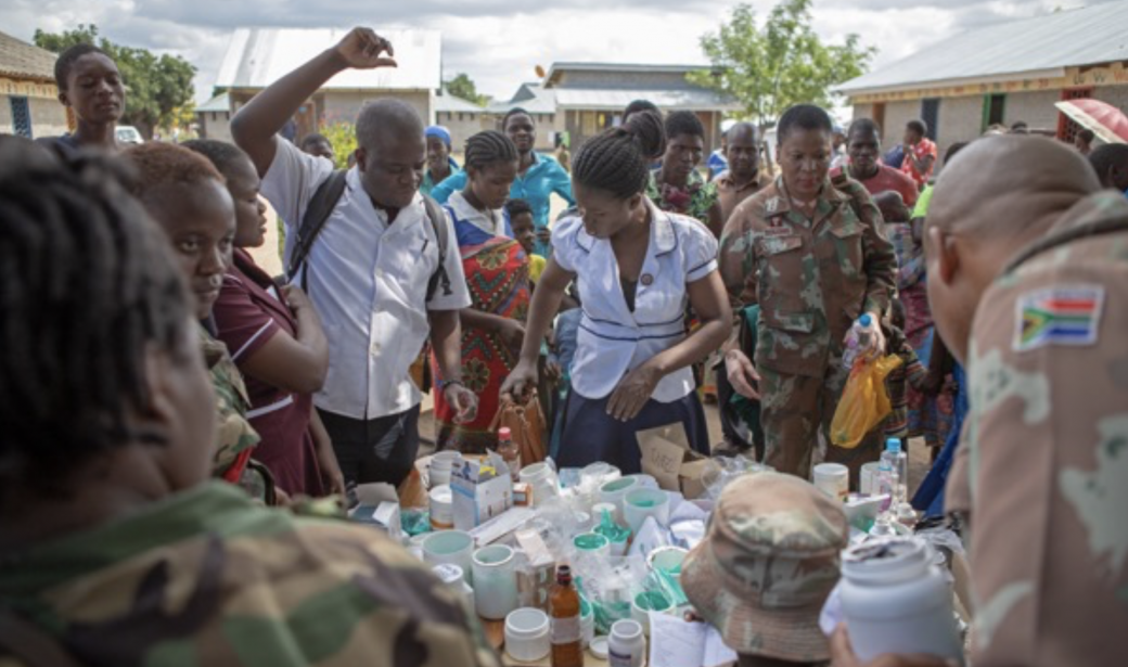  South African army and Malawi Defence Force personnel dispensing medicine.