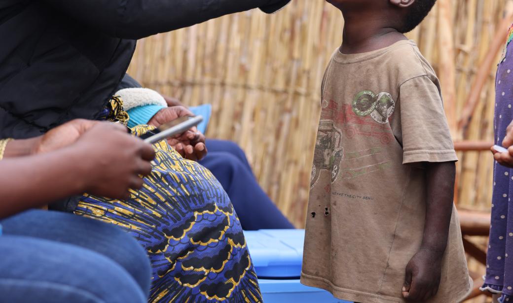 A child receiving oral cholera vaccine